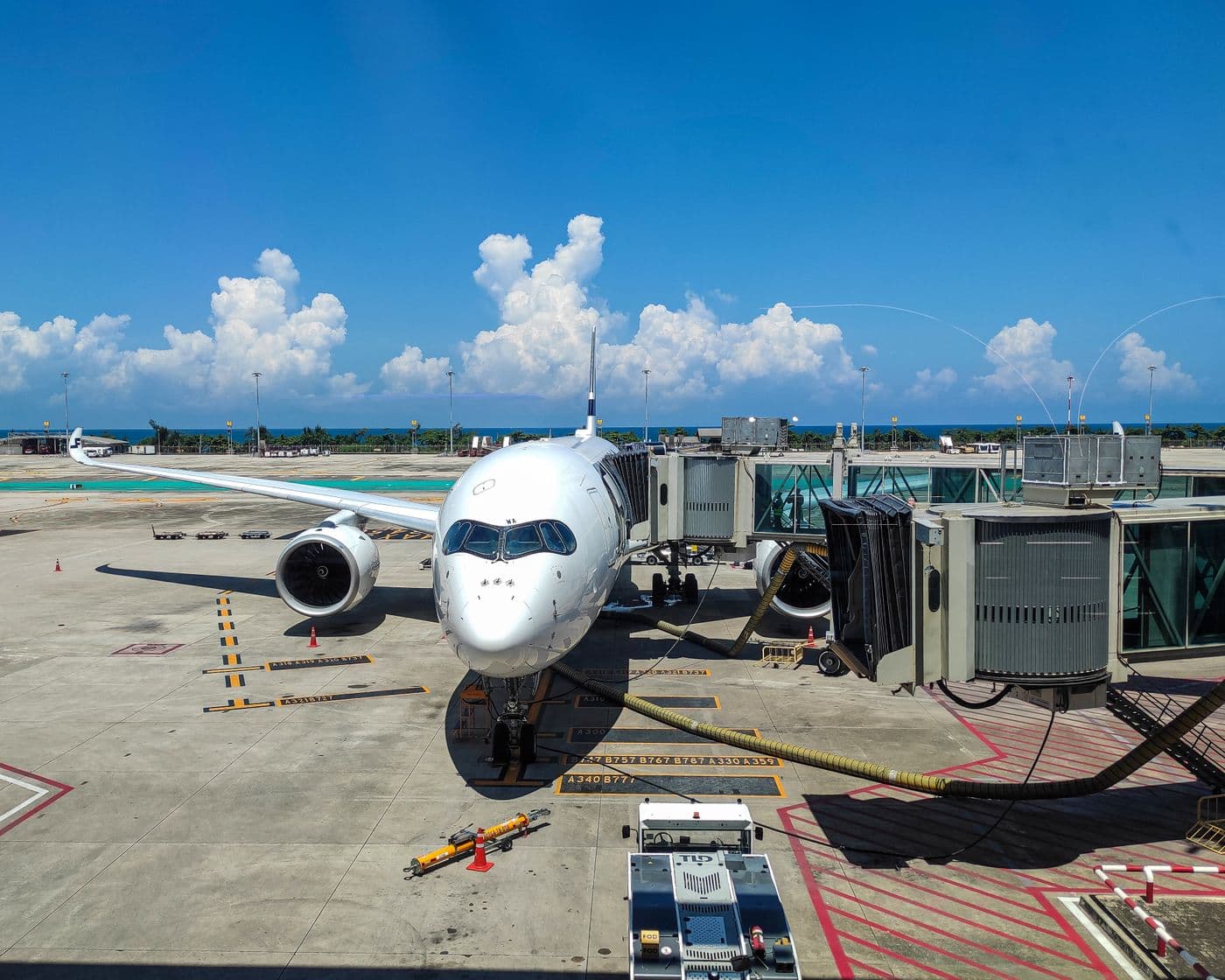 Jet plane at the gate at Phuket International Airport on a bright summer day