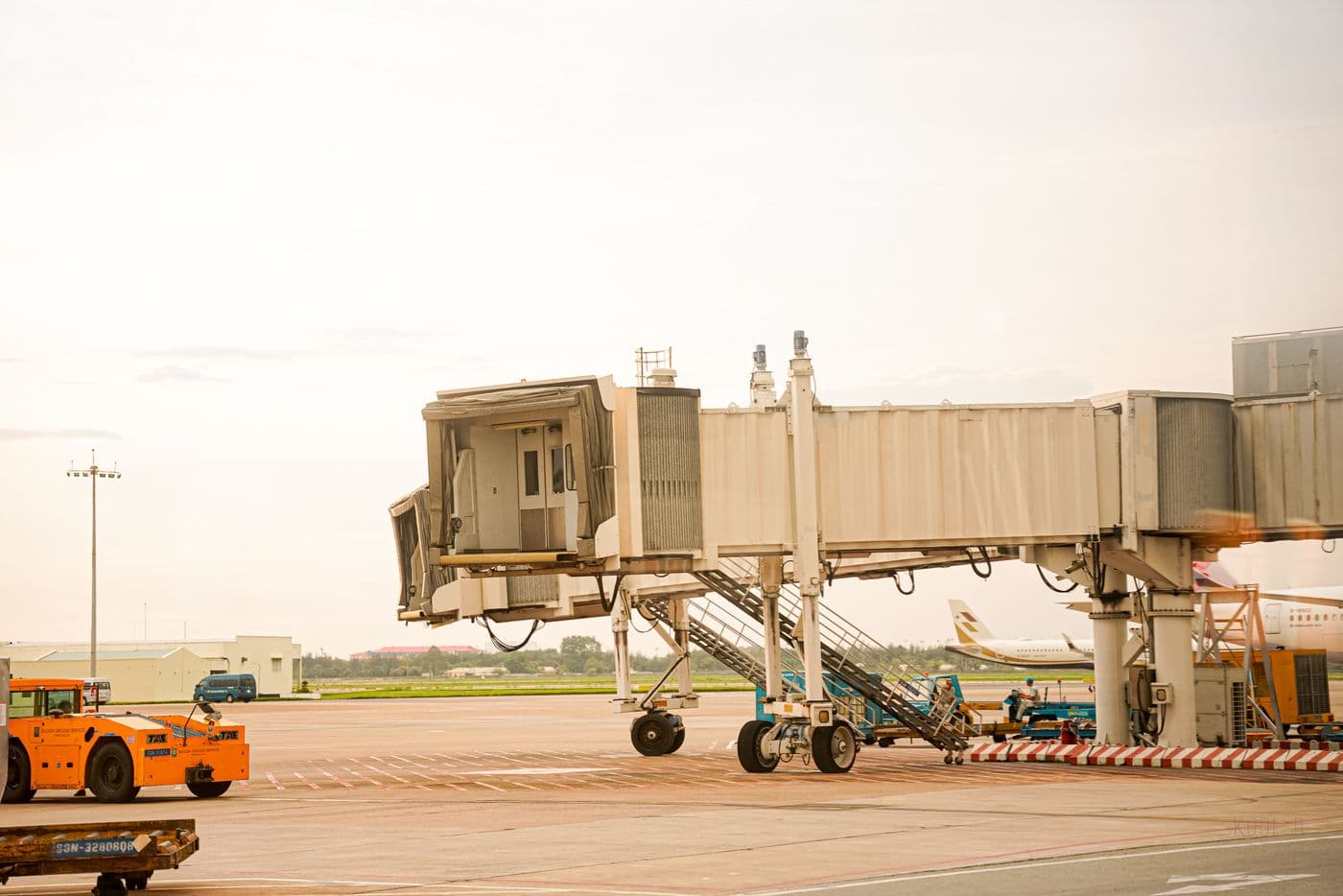 Airport jet bridge and apron on a clear day